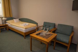 Postel nebo postele na pokoji v ubytování Hotel u Crlíků