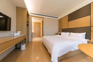 Postel nebo postele na pokoji v ubytování JI Hotel Shanghai Zhangjiang