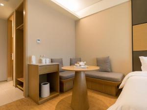 Postel nebo postele na pokoji v ubytování JI Hotel Shanghai Zhangjiang