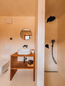 a bathroom with a sink and a mirror at Maison Lenka in Rateče