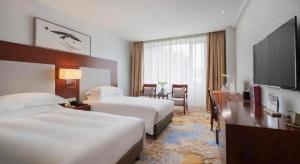 TV a/nebo společenská místnost v ubytování Xiamen Airlines Quanzhou Hotel