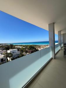 an empty room with a view of the beach at Attico Sabbia D'oro - V Apartments in Gallipoli +45 photos