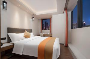 Letto o letti in una camera di Changsha Feiji Hotel