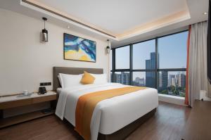 Letto o letti in una camera di Changsha Feiji Hotel