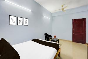 Postel nebo postele na pokoji v ubytování Super Hotel O Kanathur ECR