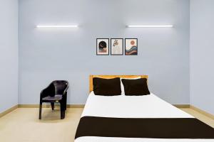 Postel nebo postele na pokoji v ubytování Super Hotel O Kanathur ECR