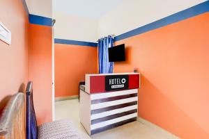 TV a/nebo společenská místnost v ubytování Super Hotel O Kanathur ECR