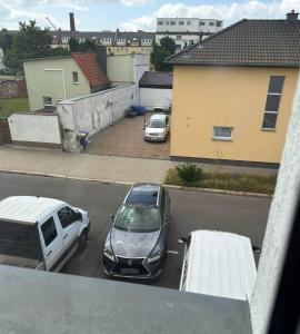 a couple of cars parked in a parking lot at Apartment on Elbe bike path in Magdeburg