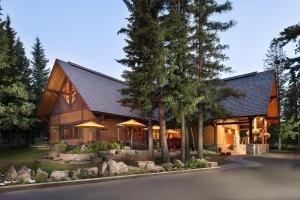 a wooden house with a gambrel roof at Buffalo Mountain Lodge in Banff