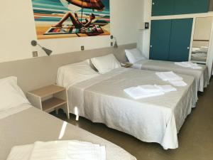 Postel nebo postele na pokoji v ubytování Hotel Internazionale