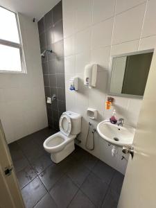 a bathroom with a toilet and a sink at AYAAN PENTHOUSE at Golden Hill Night Market View in Brinchang +25 photos