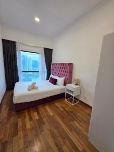 Letto o letti in una camera di Reizz Residence By Nexus Suites