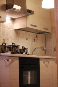 a kitchen with a sink and a stove top oven at Casa P&G in Niscemi