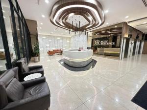 Area soggiorno di Reizz Residence By Nexus Suites
