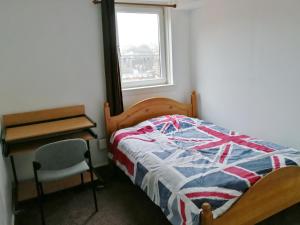 Postel nebo postele na pokoji v ubytování Glasgow Entire Property