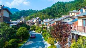 a street in a small town with houses at Avatar Valley Villas in Zhangjiajie +79 photos