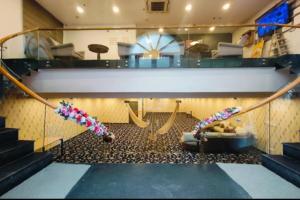a room with escalators and slides in a building at RROOMS Hotel La-Maison in Lucknow