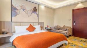 Postel nebo postele na pokoji v ubytování Oriental Hotel