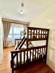 Ένα ή περισσότερα κρεβάτια σε δωμάτιο στο Seawind Condominium Near Airport Building3 3BEDROOM