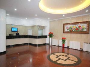 a lobby with a reception desk in a hotel at Jinghua Hotel Xingtai Train Station in Xingtai