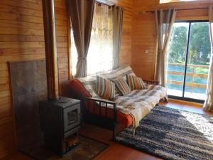 Khu vực ghế ngồi tại Cabañas Torre Huillinco