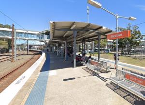 a train station with people waiting for the train at Entire Home in Blacktown in Blacktown