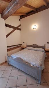 Letto o letti in una camera di Antico Fienile By Go new Location