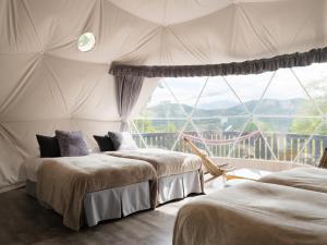 Postel nebo postele na pokoji v ubytování TOCORO. Mt.Fuji CAMP&GLAMPING