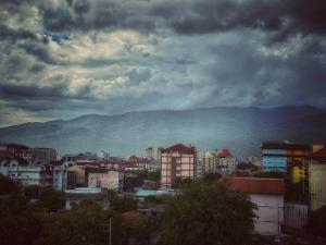 a view of a city with mountains in the background at Noble Boutique Hotel Chiang Mai By J&S Property in Chiang Mai