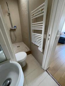 a small bathroom with a toilet and a sink at Odéon in Paris