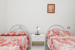 Postel nebo postele na pokoji v ubytování Trilo Deledda