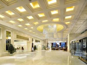 a large lobby with a chandelier in a building at Beijing Liaoning Hotel in Beijing +172 photos