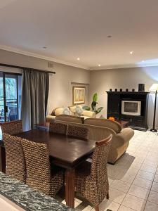 a living room with a couch and a table at Tranquility in Margate