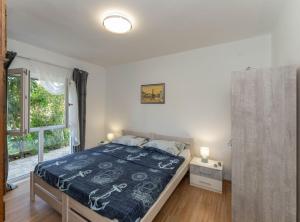 Ένα ή περισσότερα κρεβάτια σε δωμάτιο στο Holiday Home Sanda