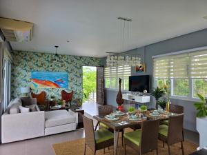 a living room with a table and a couch at One Hagdan Villas in Boracay