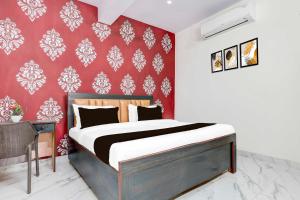 Postel nebo postele na pokoji v ubytování Collection O Jawaharlal Nehru Stadium Ghaziabad