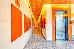 an empty hallway in a building with at Super Hotel O Indiranagar in Bengaluru