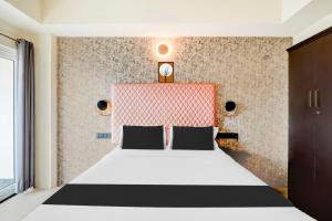 Letto o letti in una camera di Collection O Mysore Central