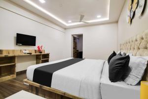 Postelja oz. postelje v sobi nastanitve Super Townhouse Indore Junction