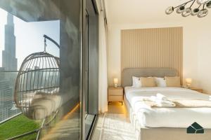 Cama o camas de una habitación en High Floor 2BR with Full Burj View by BMS
