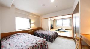 Postel nebo postele na pokoji v ubytování Hotel Selan