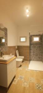 a bathroom with a toilet and a tub and a sink at ROMANTICA TOSCANA in Scarlino +66 photos