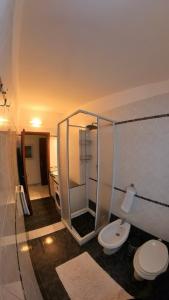 a bathroom with a shower and a toilet in it at Levantea Liv'In Italy in Marsala