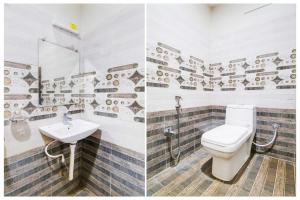 a bathroom with a toilet and a sink at Collection O Ramakrishna Beach in Visakhapatnam