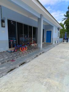 a group of bikes parked outside of a building at Villa Atok Opah in Teluk Intan