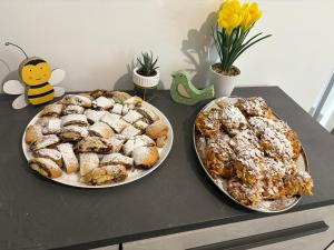 two plates of pastries are sitting on a table at Paradise Rooms in Ripabottoni +26 photos