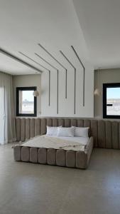 a large bedroom with a large bed in a room at La Villa K Marrakech jacuzzi chauffé in Marrakech