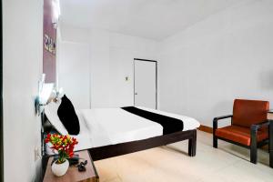 Giường trong phòng chung tại Townhouse Oak Margao Madgaon Railway Station +19 ảnh