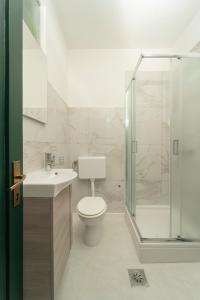 a bathroom with a toilet and a shower and a sink at Piazza dei Signori in Zadar +37 photos