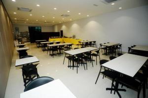 an empty restaurant with tables and chairs in it at Star-Well hotel in Kuala Lipis